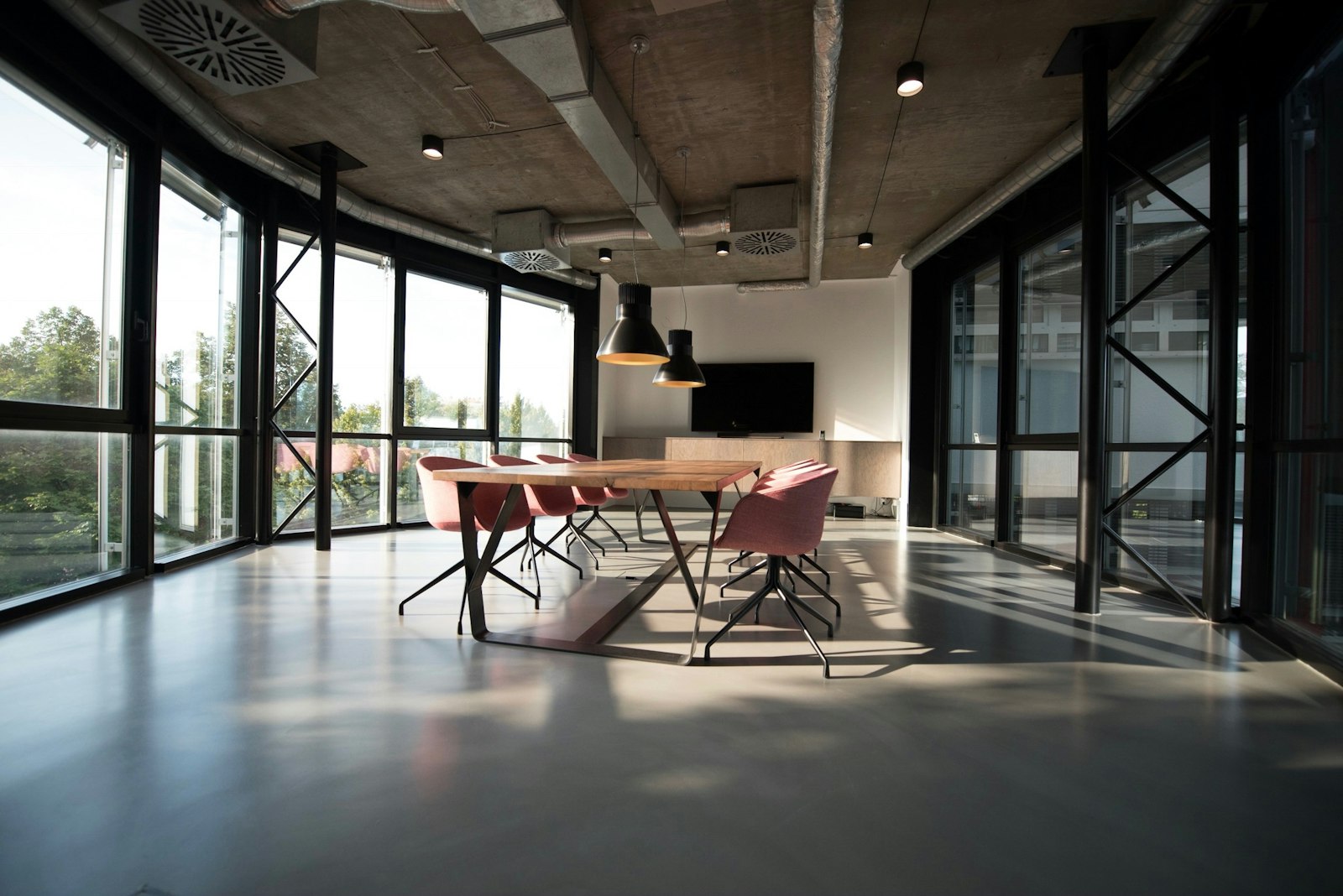 Income drive studio workspace with laptops and training materials at Marina Centre