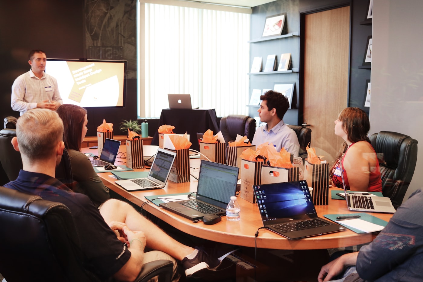 Workshop participants seated at a round table during a corporate AI income training session
